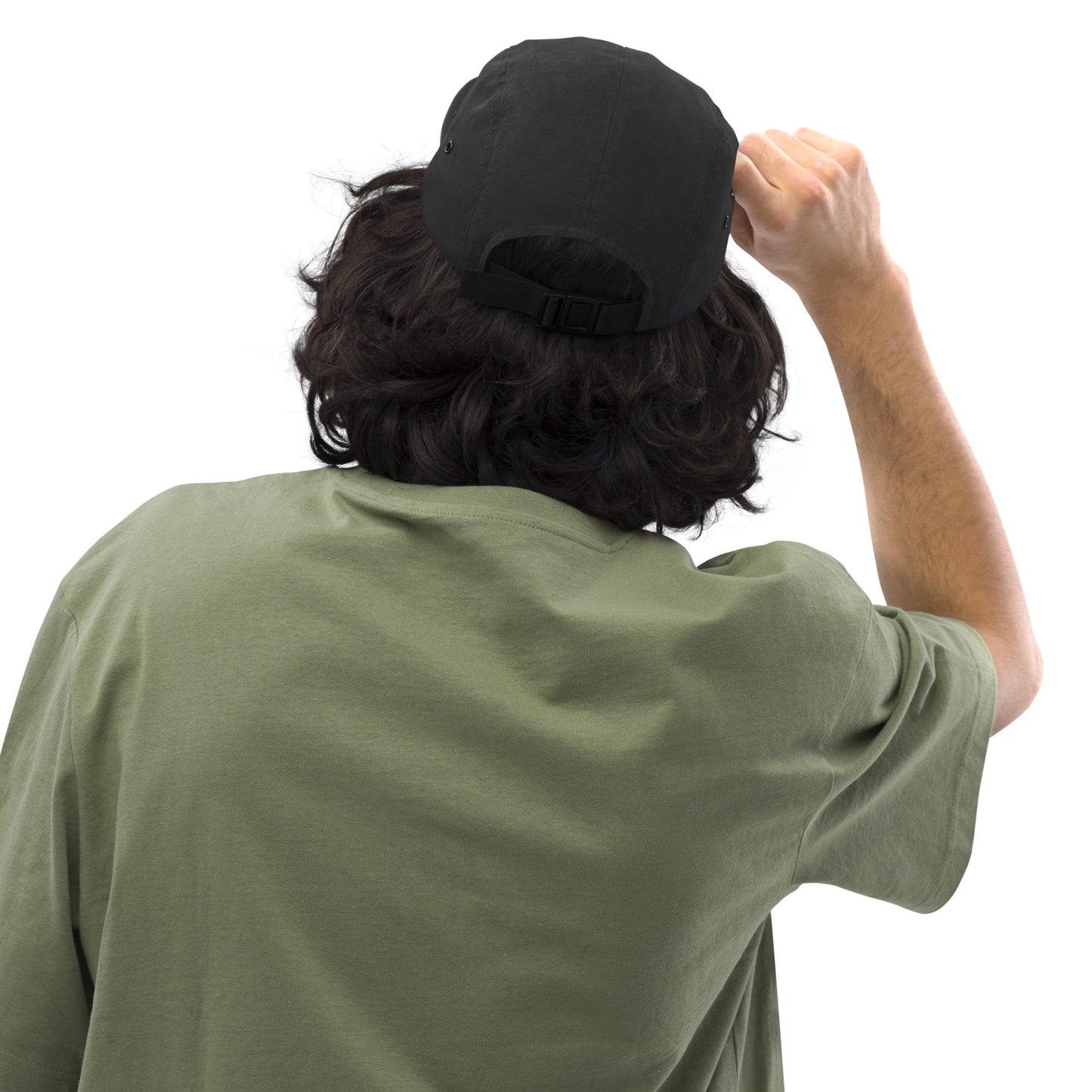 Chillhawk Five Panel Cap black - back view of a person with medium-toned skin and dark, wavy hair, wearing the black cap and an olive green t-shirt, adjusting the strap on the back of the cap with their right hand.