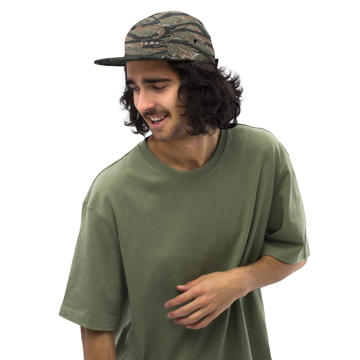 Chillhawk Five Panel Cap green tiger camo - front view of a person with medium-toned skin and dark, wavy hair, wearing the green tiger cap and an olive green t-shirt.